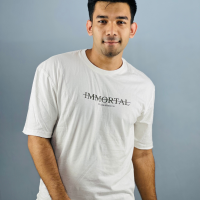 "Whispering Breeze: White Drop Shoulder Cotton T-Shirt with Printed Design"